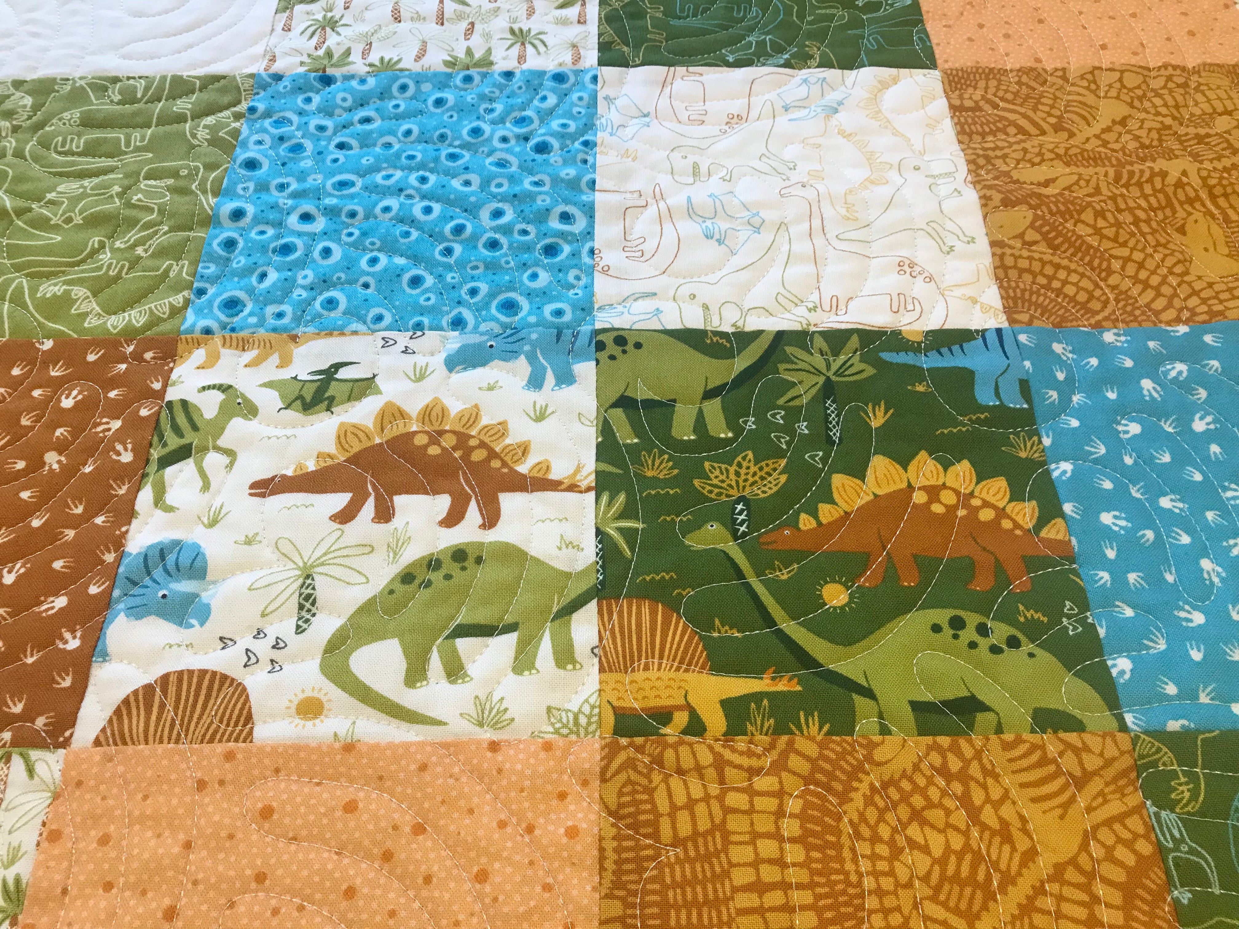 Dinosaur baby quilt sale